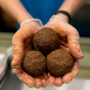 OUTRIGGER Gets Its Hands Dirty This World Ocean Month in Hawai‘i with 5,000+ Mud Balls