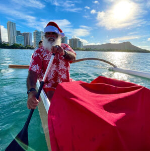 Canoe-Surfing Santa Arrives to Outrigger Waikiki Beach Resort With a Shaka and Mele Kalikimaka!